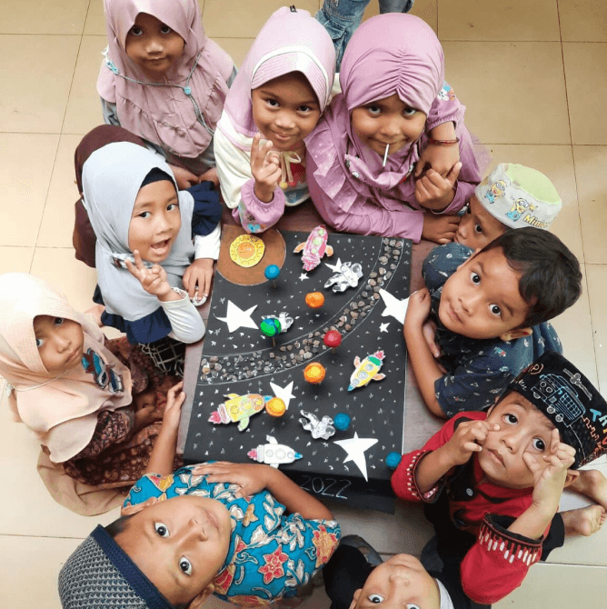 Children making colorful crafts together